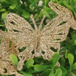 Motyle na druciku brokatowe złote 24szt