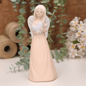 Aniołek dziewczynka z serduszkiem 19cm brzoskiwniowy