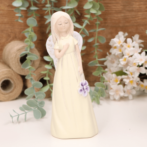 Aniołek dziewczynka z kwiatuszkiem 19cm żółty